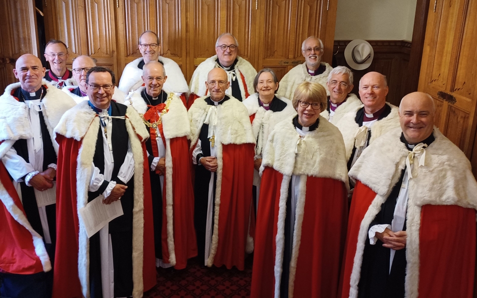 A photo showing the Lords Spiritual in their formal robes at the State Opening of Parliament